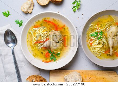 Quail Noodle Soup, Homemade Broth With Noodles And Vegetables Served With Bread Rolls, Zama, Traditi