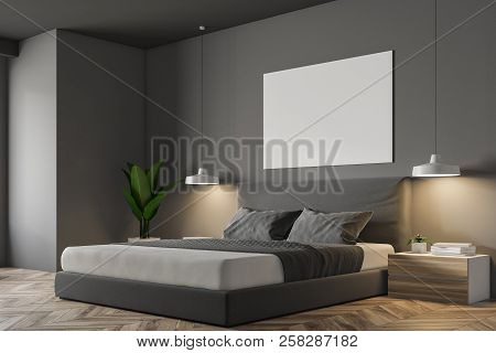 Gray Wall Minimalistic Bedroom Corner With A Wooden Floor, Masterbed Standing On It And Night Stands