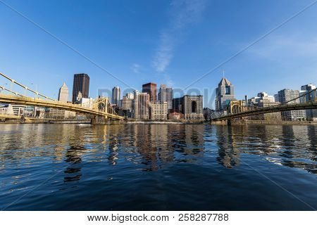 Downtown urban waterfront and bridges crossing the Allegheny River in Pittsburgh Pennsylvania.