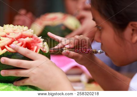 Nakhonratchasima, Thailand - August 31, 2018:asian Little Girl Carve Fruit In School