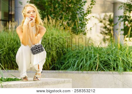 Elegant Fashionable Woman Presenting Trendy Urban Outfit. White Crop Top And Trousers Culottes. Outd