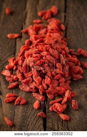 Dried Fruits Of Goji Berries Or Wolfberry On Rustic Wooden Table