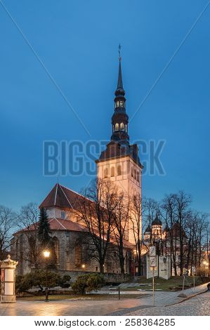 Tallinn, Estonia. Evening View Of Church Of St. Nicholas Niguliste Kirik Is Medieval Former Lutheran
