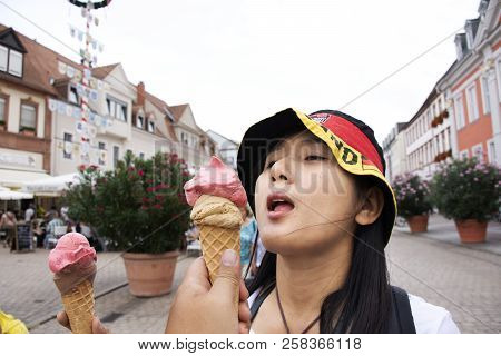 Thai Woman Show Ice Cream And Eating On The Road After Travel Visited Speyer Town In Rhineland Palat