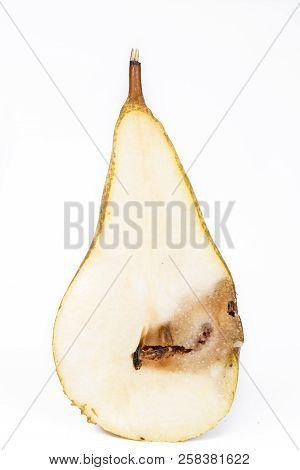 Close-up Boring Trace Of A Codling Moth Cydia Pomonella, In A Half Middle Wormy Pear. On White Backg