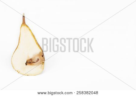 Close-up Boring Trace Of A Codling Moth Cydia Pomonella, In A Half Middle Wormy Pear. On White Backg