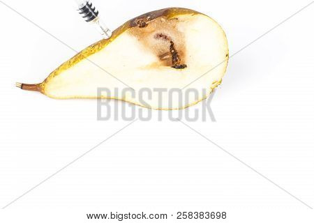 Close-up Boring Trace Of A Codling Moth Cydia Pomonella, In A Half Middle Wormy Pear. On White Backg
