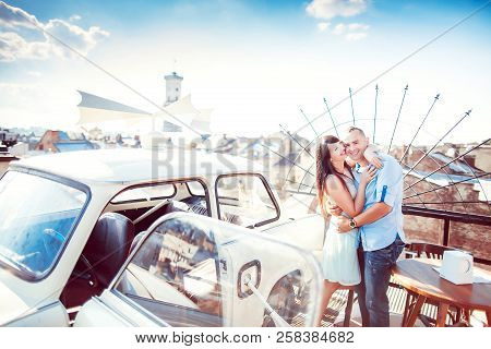 Happy Couple Near The Car High On A Rooftop Overlooking The City, Walk The City, Set, Walk The City.