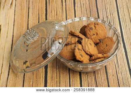 A Bowl Of Choco Chips Cookies On White Wooden Table