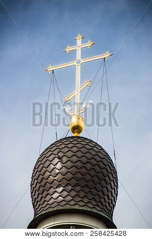 Golden Cross On The Dome Of The Temple. Gold Cross On A Blue Sky