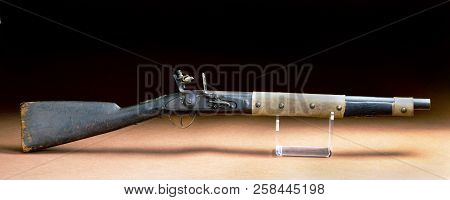 American Flintlock Rifle Made Around 1840 And Used By American Indians With Buffalo Hide Repair.