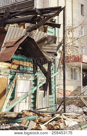 Demolition House Using Excavator In City. Rebuilding Process. Remove Equipment
