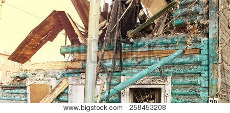 Demolition House Using Excavator In City. Rebuilding Process. Remove Equipment