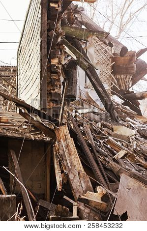 Demolition House Using Excavator In City. Rebuilding Process. Remove Equipment