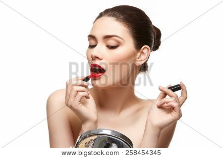 Girl Applying Red Lipstick Isolated On White