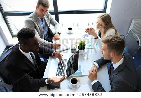 Top View Of Business People Working Together While Spending Time In The Office.