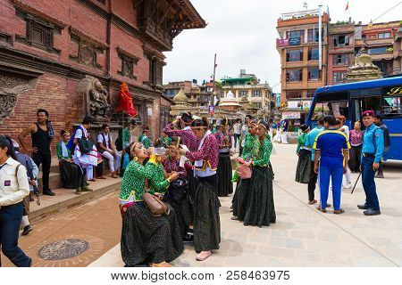 Group Of Dancers Wearing Traditional Costumes In Patan Durbar Square, Kathmandu Valley, Nepal