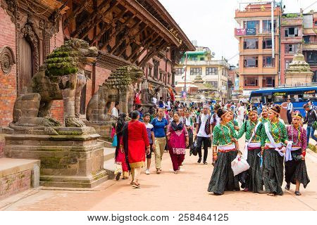 Group Of Dancers Wearing Traditional Costumes In Patan Durbar Square, Kathmandu Valley, Nepal