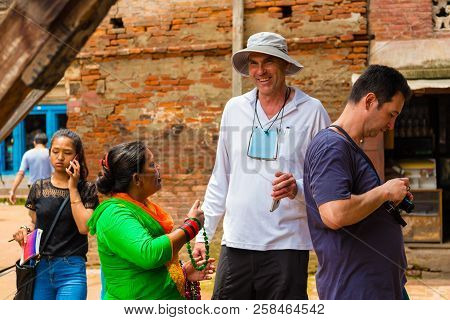 Tourists Buying Souvenirs At Patan Durbar Square, Kathmandu Valley, Nepal