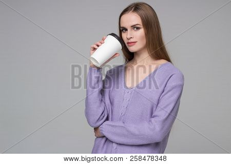 Girl In Lilac Jamper Drinking Coffee From Paper Plastic Glass