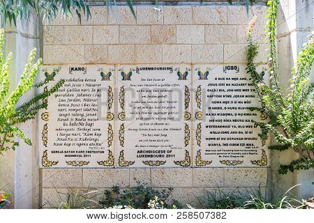 Tiberias, Israel, September 10, 2018 : The Lines From The Gospel Of Mark In Karo, Luxembourgish And 