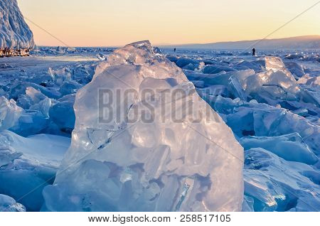 Field Of Ice Hummocks On The Frozen Lake Baikal. Sunset
