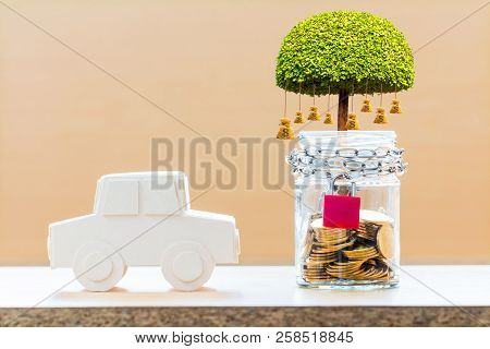 Car Model And Jar Bank With Security And Lock With Red Key And Coin And Gold Bar Inside With Money B