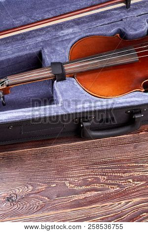 Retro Violin In Case And Copy Space. Musical Instrument Of Orchestra On Wooden Background, Vertical 