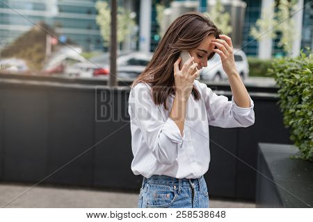 Busy Female Manager Calling With Cell Telephone Outside, Woman Talking Via Mobile Phone And Walking 
