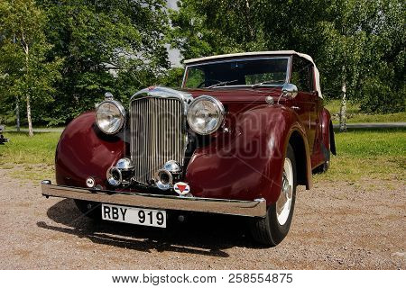 Rottle, Sweden - July 4, 2004: Front View Of A Wine Red 1949 Alvis Ta 14 Drophead Cabriolet.