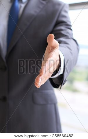 Unknown Business Man Offering Handshake While Standing Straight. Success Cooperation And Agreement C