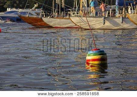Nautical Part Of A Yacht With Cords, Rigging, Sail, Mast, Anchor, Knots On Yachts Tied Up To Buoys A