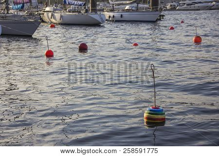 Nautical Part Of A Yacht With Cords, Rigging, Sail, Mast, Anchor, Knots On Yachts Tied Up To Buoys A