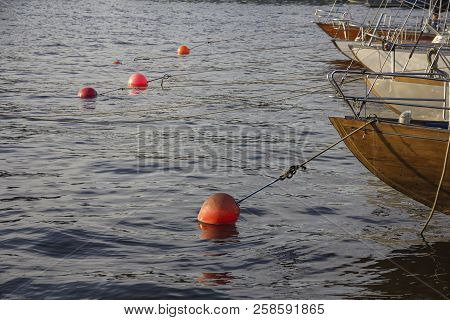 Nautical Part Of A Yacht With Cords, Rigging, Sail, Mast, Anchor, Knots On Yachts Tied Up To Buoys A