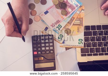 Budget Planing Concept. Top View Of A Woman Writing Categories Of Expences For Her Budget To Create 