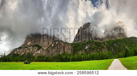 Storm Clouds Over The Summit Of Mountains