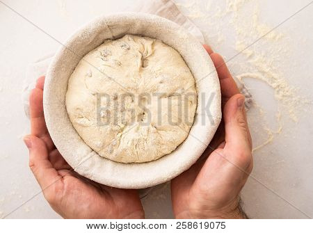 Hands Holding Dough Ready For Baking, Closeup, Copy Space.