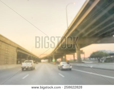 Blurry Background Highway Interstate With Elevated Road Viaducts At Sunrise In Usa