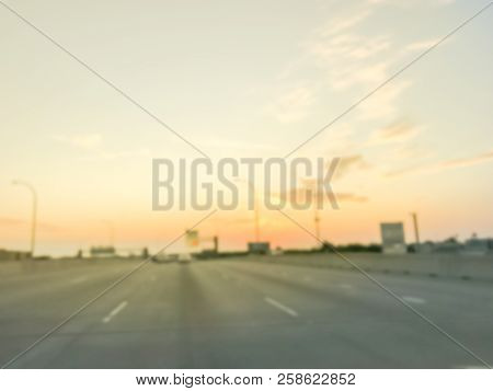 Blurry Background Usual Traffic Condition On Highway Interstate At Sunrise In Usa