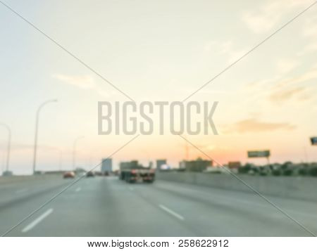 Blurry Background Long Vehicles Commute On Interstate Highway At Sunrise