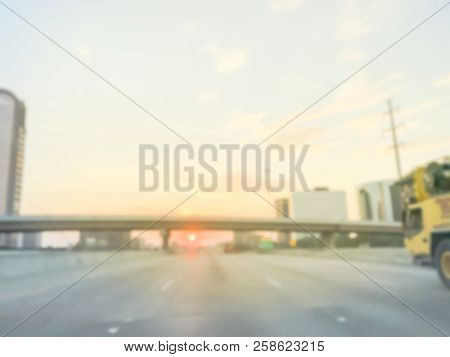 Blurry Background Highway Traffic With Long Vehicles Near Bridge Grade Separation