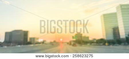 Panoramic Blurry Industrial Background Highway Traffic With Downtown Skylines At Sunrise