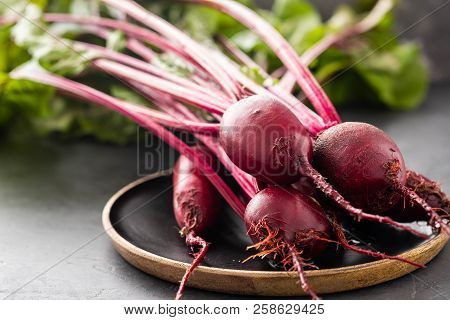 Beet, Beetroot Bunch On Wooden Plate On Grey Stone Background. Copy Space. .