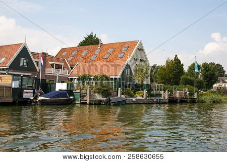 Zaanse Schans, Netherlands, August 19, 2015 - Traditional Dutch Houses And Boats At The Canal.