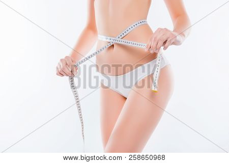 Cropped Close Up Photo Of Fatless Slender Body Parts And Proportions Woman's Hands Holding White Cen
