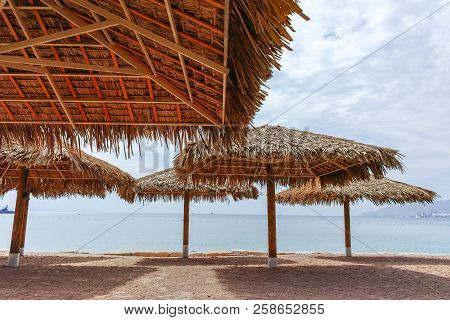 Beautiful Public Sandy Beaches On Red Sea In Eilat With Stro Umbrellas, Luxury Vacation Spa Resorts