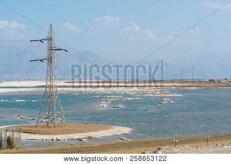 Power Line Above Lowest Salty Lake In World Below Sea Level Dead Sea, Full Of Minerals Near Ein Boke
