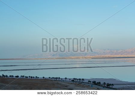 Sunset Over Lowest Salty Lake In World Below Sea Level Dead Sea, Full Of Minerals Near Luxury Vacati