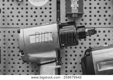 Electric Tools For Construction On The Stand In The Shop