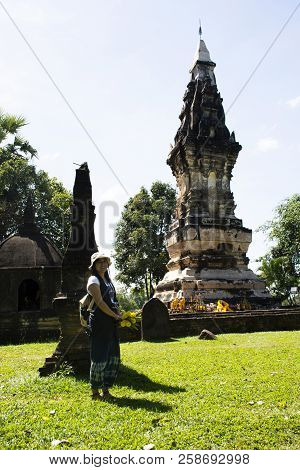 Thai Woman Travel Visit And Respect Praying Chedi Or Stupa Phra That Kong Khao Noi In Yasothon, Thai